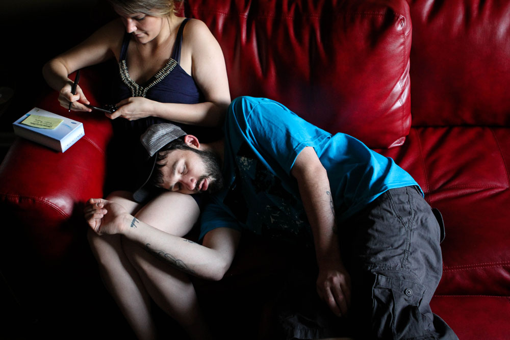 Ryan takes a nap on girlfriend Larae's lap at his mother's house. The two prefer to spend time there because it's air-conditioned and there's much more space, but Ryan and his mom have a tense relationship, so her home isn't always an option.