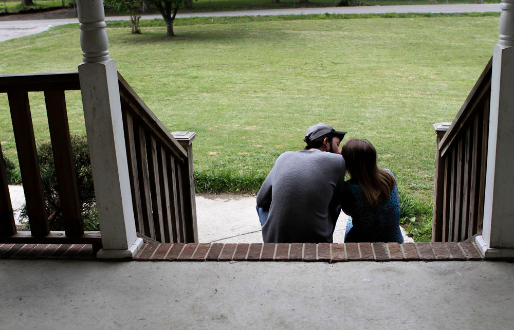 Ryan and Larae share a kiss on the steps of his mother's porch.